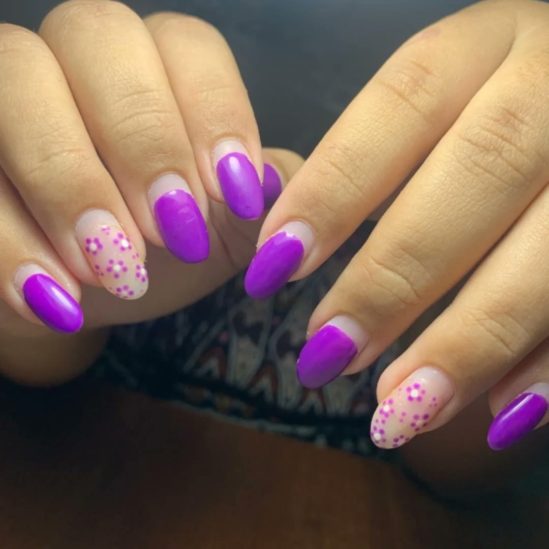 Purple gel nails with white flower art